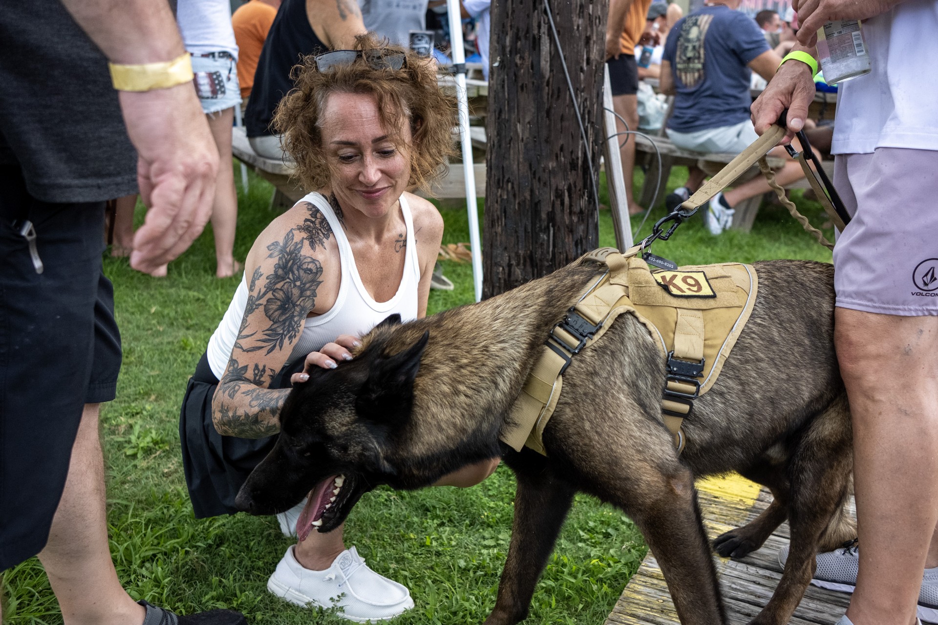 An attendee greeting a service dog at NautiFest 2026