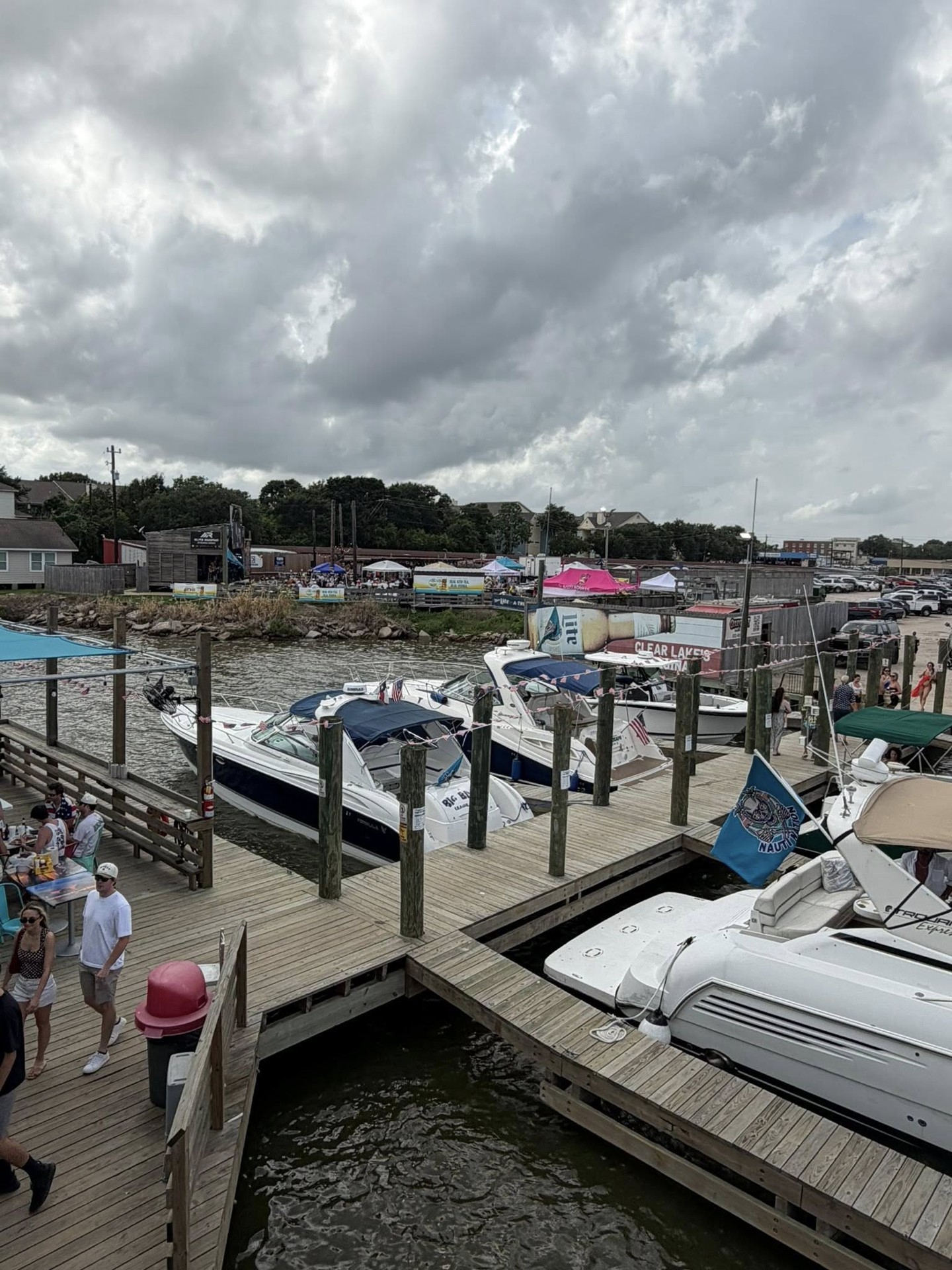Boats and Nauti Nation flags at the NautiFest 2026 docks