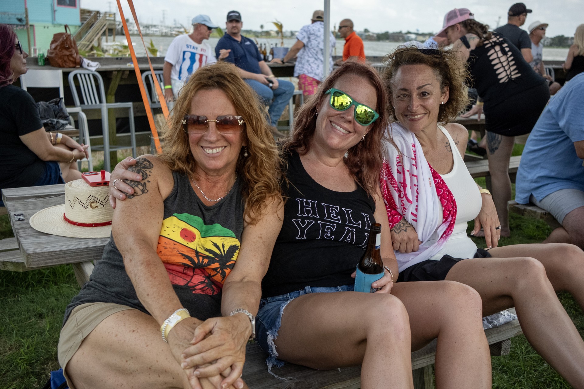 Three friends smiling at NautiFest 2026