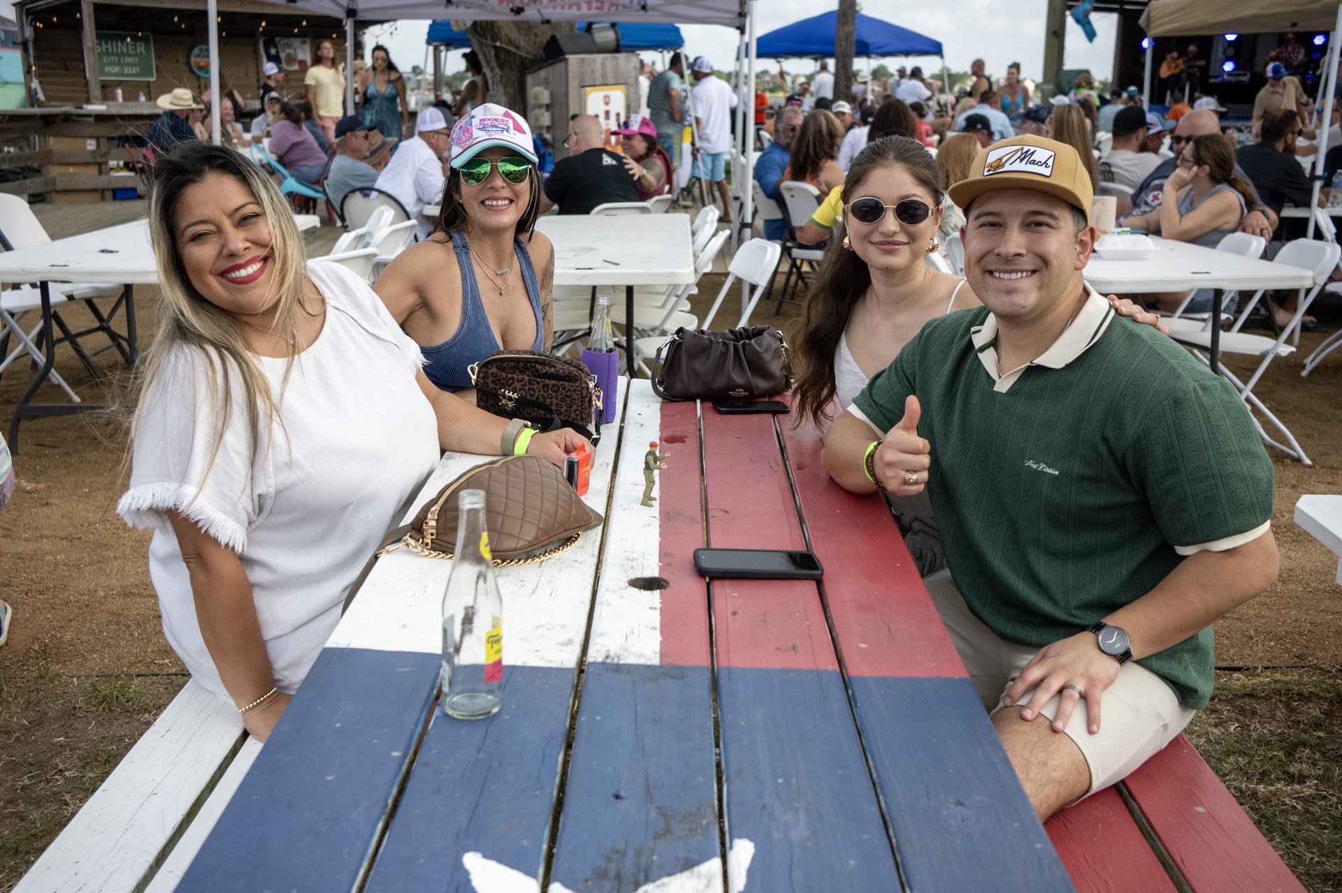 The crew hanging out at a colorful picnic table