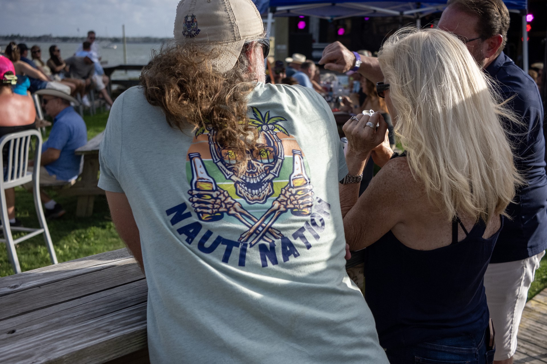 An attendee wearing Nauti Nation at the event