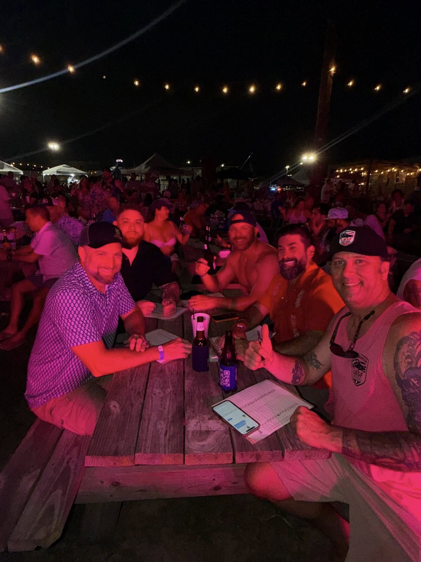 The NautiFest 2026 night crowd celebrating together under the string lights